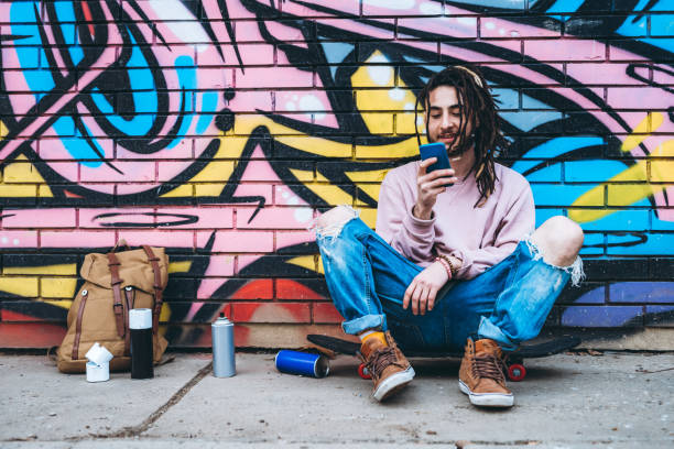 istock Graffiti artist listens to music 1386282516