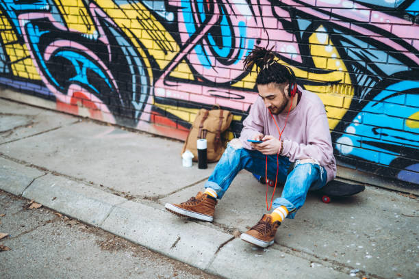 istock Graffiti artist listens to music 1386283055