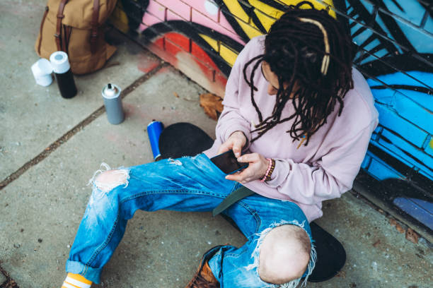 istock Graffiti artist listens to music 1386283594