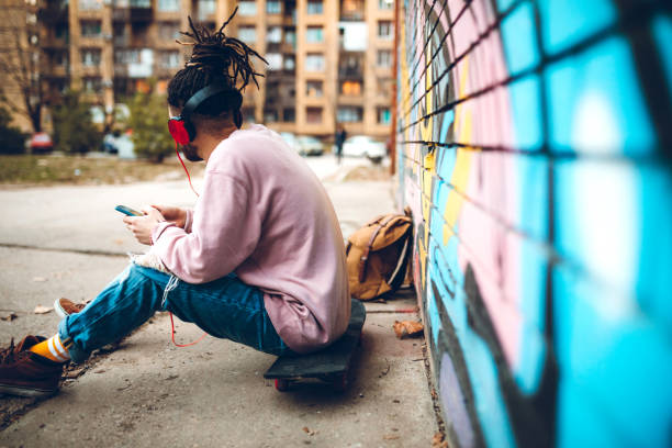 istock Graffiti artist listens to music 1386283609
