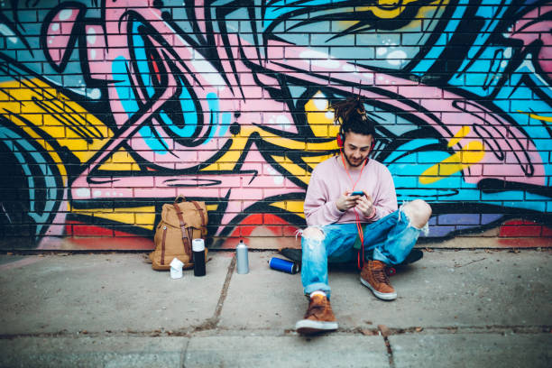 istock Graffiti artist listens to music 1386283640