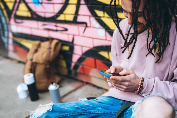 istock Graffiti artist checking social media 1386283684
