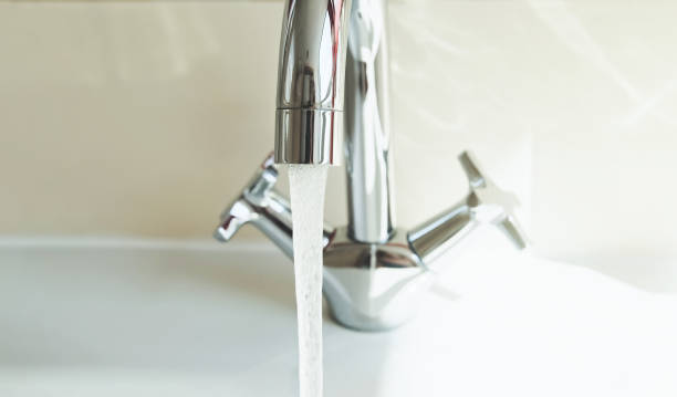 istock Faucet in bathroom with running water tap, it pours water. Save and protect environment. 1386285039