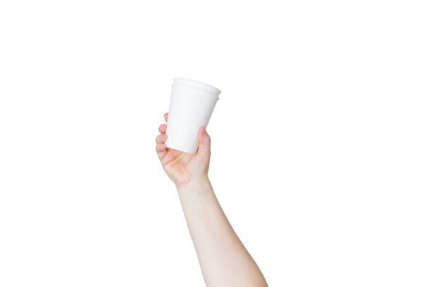 istock hand holding a paper cup and use of paper utensils on a white background, garbage sorting 1386287618