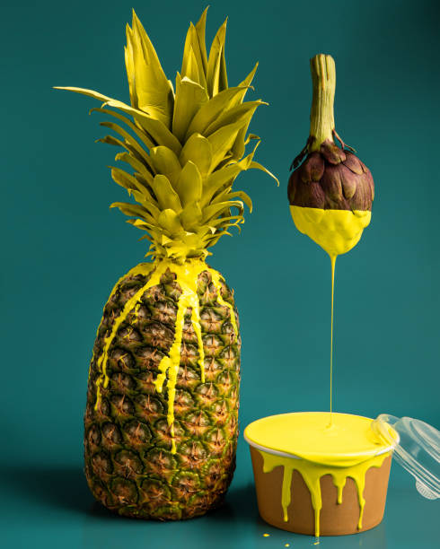 Modern design. Pineapple with yellow paint and artichoke brush. Creative image