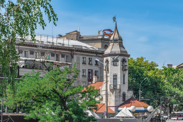 Mykolaiv, Ukraine - July 26, 2020: A modern building with creative architecture on Central Avenue in Mykolaiv. Beautiful cityscape on a sunny summer day