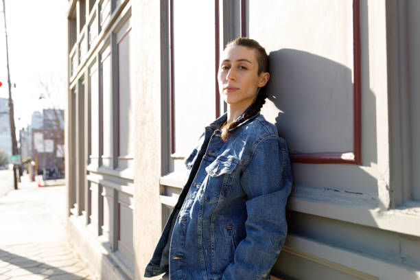 istock A Transgender Person Leaning Against a Building 1386290561