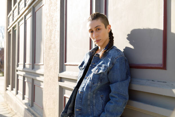 istock A Transgender Person Leaning Against a Building 1386291089