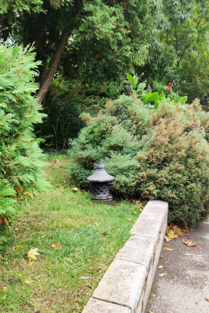 istock Japanese stone lantern in landscape design in the park 1386291311
