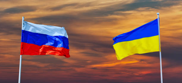 istock Waving Russian and Ukraine flag 1386295766