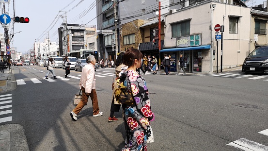 march 29, 2019 - Kyoto, Japan: Japanese people crossing the street in kyoto