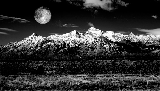 Moonrise over the Teton Range of Grand Teton National Park in the U.S. state of Wyoming