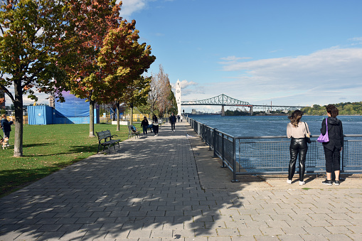 Montreal Clock Tower, Bridge, Water, People Walking, Building Exterior View During Autumn Season At Old Port Of Montreal In Quebec Canada
Photographed With Nikon D7200 DSLR Camera