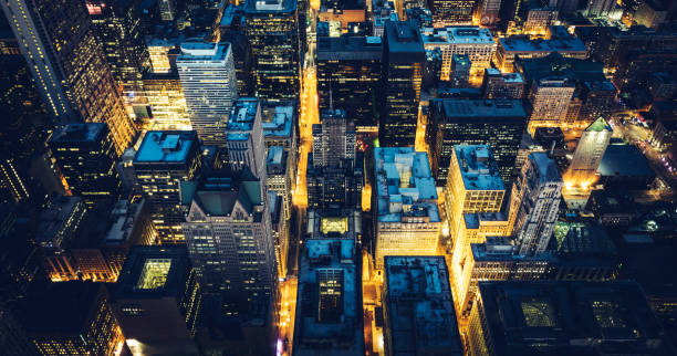 istock Aerial panoramic view of Chicago by night 1386300934