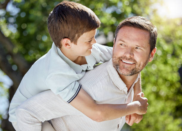 istock Shot of a man spending time outdoors with his young son 1386305248
