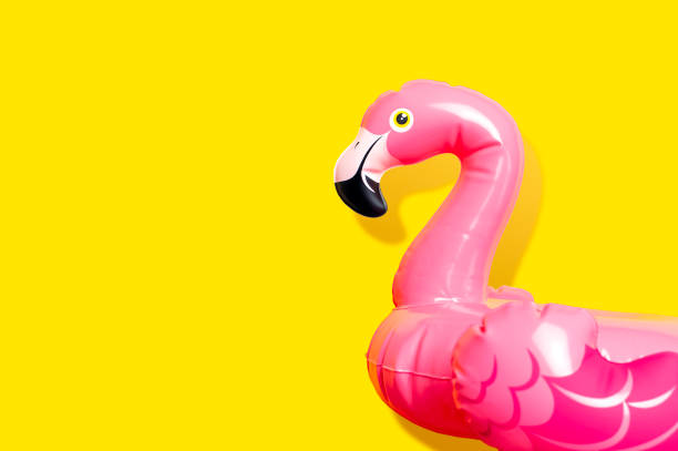 istock Creative summer beach concept. Inflatable pink mini flamingo on yellow background, pool float party. Flat lay, copy space. Flamingo Trend Inflatable Toy. Summer background. Layout for design 1386306237