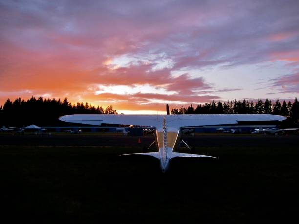 A Taildragger faces into a July sunset at the Arlington Airport in Washington State. The Arlington Fly-In, also known as the Arlington Air Show, is an annual airshow hosted in Arlington, Washington at the Arlington Municipal Airport (IATA airport code AWO). Thousands of general aviation pilots fly in from around the country and camp for up to four days, many showing their aircraft for judging. The Northwest Fly-In is the third largest in the nation, after Oshkosh's EAA AirVenture Oshkosh and Lakeland's Sun N' Fun. July 7, 2011.