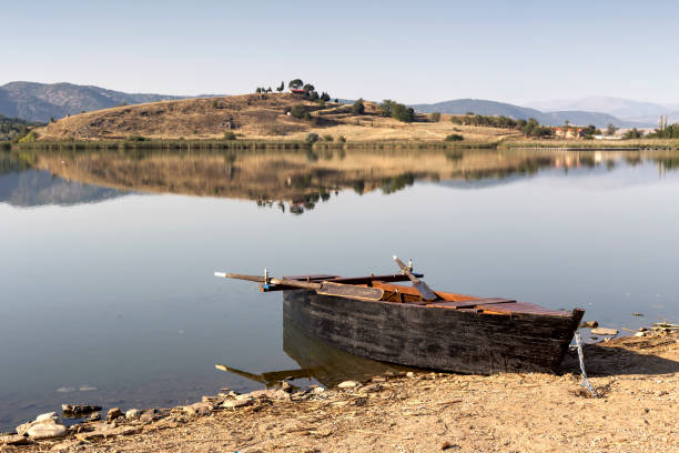Boat moored to the shore on the lake Zazari (northwest Greece, Macedonia)