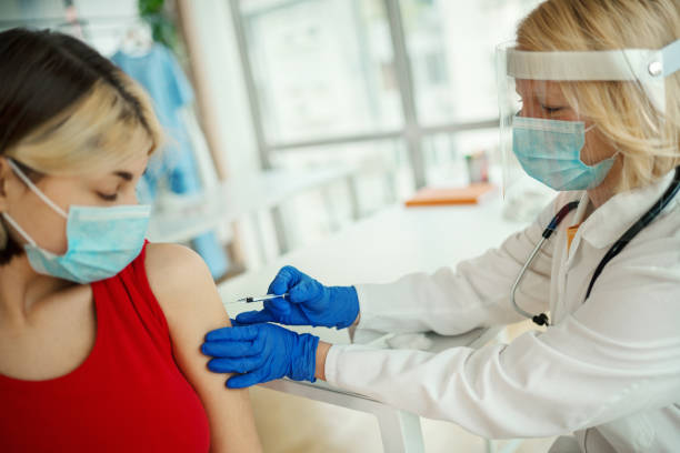 istock Young woman having Covid-19 vaccine. 1386312971