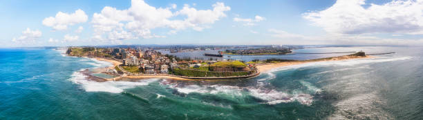 D Newcastle 2 pool 2 head pan Wide aerial panorama of Newcastle city in Australia on Pacific ocean coast - industrial hub and cargo port. newcastle new south wales photos stock pictures, royalty-free photos & images