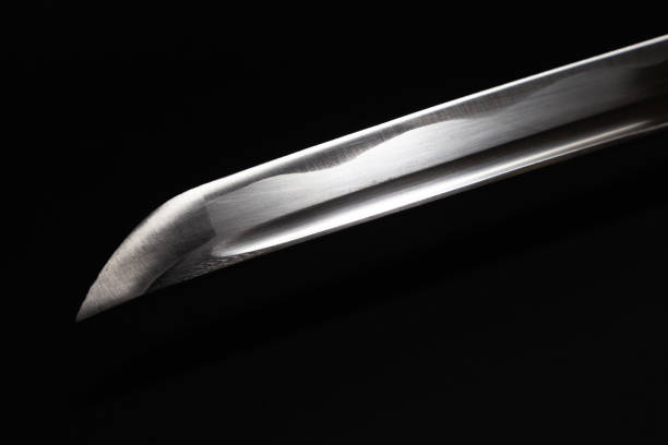 istock Japanese katana sword on the black background 1386324284