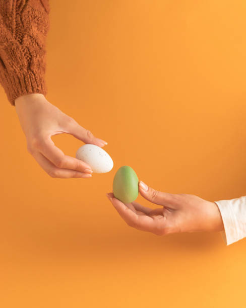 istock Tapping the Easter eggs - egg knocking game. Egg fight illustration photo. Happy Easter. 1386332539
