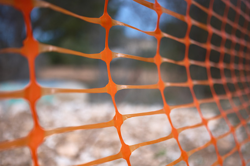 detail of a protective fence or mesh for signaling or delimitation in a construction site