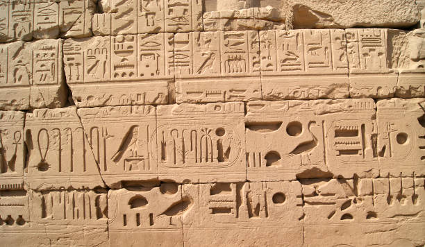 istock Ancient Egyptian writing, Egyptian hieroglyphs, wall inscriptions 1386334431
