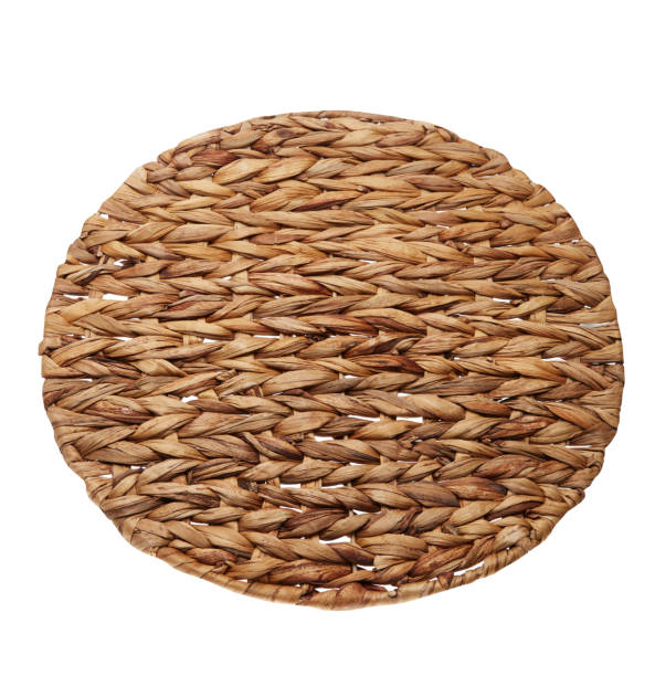 istock Handmade round woven placemat placed on a white background 1386334803