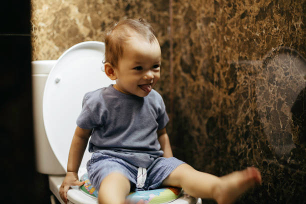 istock Happy Cute  Little Boy Potty Training 1386341302