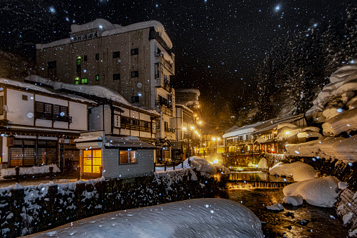 Japan - January 28, 2019 : Scenic Illumination of Japanese Traditional Hotel and Ryokan in Winter Snow Day at Ginzan Onsen, One of most famous tourist destination for Onsen bathing, Yamagata