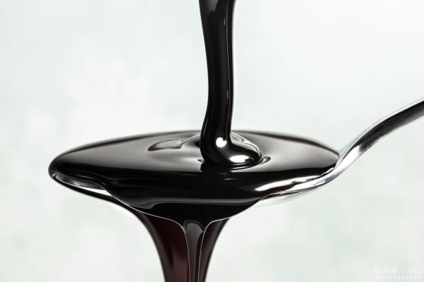 Molasses Poured on a Spoon stock photo