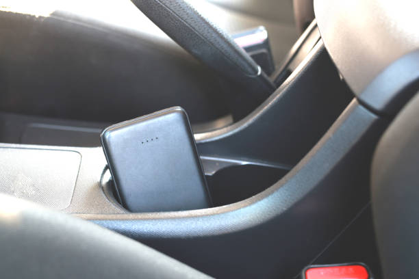 istock Plug to charge mobile phone in the car. 1386370644
