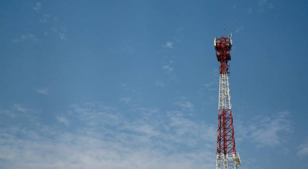 istock telecommunication antenna little clouds and blue sky 1386370960