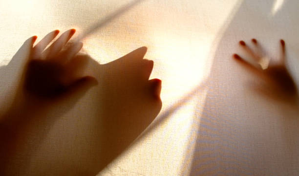 istock Blurred horror scary shadow of someone , call for help 1386373398