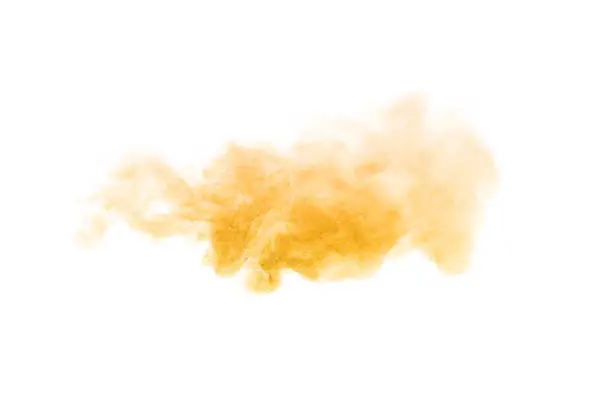 gold dust powder explosion. The texture is abstract and splashes float. on a white background