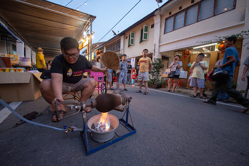 Nibong Tebal, Penang, Malaysia - Feb 01 2019: Traditional charcoal pop corn making at street.