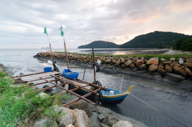 Georgetown, Penang, Malaysia - May 28 2018: Fisherman boat hang with PAS flag at sea coastal