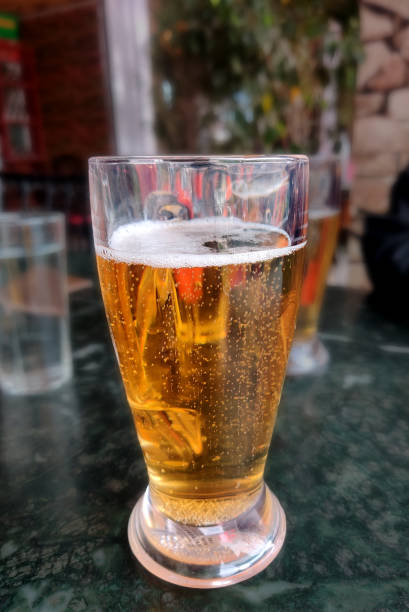 istock a glass of beer on the table, alcohol 1386385255
