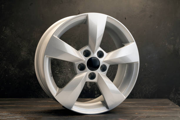 istock new grey alloy wheels on a dark textured black background. a wheel for a car 1386386447