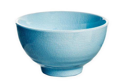 Ceramic bowl with cracked pattern, Blue bowl isolated on white background with clipping path, Side view