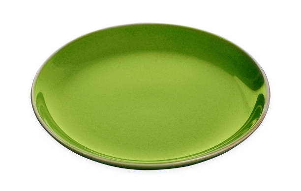 istock Empty ceramics plates, Classic green plate isolated on white background with clipping path 1386386543
