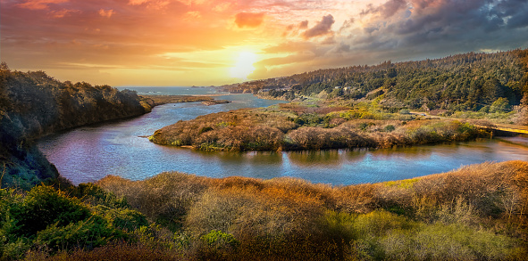 Gualala River in Mendocino California with bridge in panoramic sunset