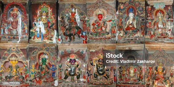 Set Of Twelve Tibetan Deities Statues In The Tibetan Monastery In China Stock Photo - Download Image Now