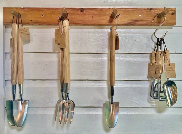 istock Wood Wall Holding Garden Tools 1386391604