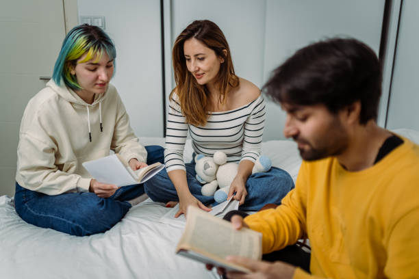 University Students discussing the Latest Book stock photo