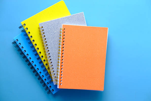 istock high angle view of color notepads on color background 1386402681