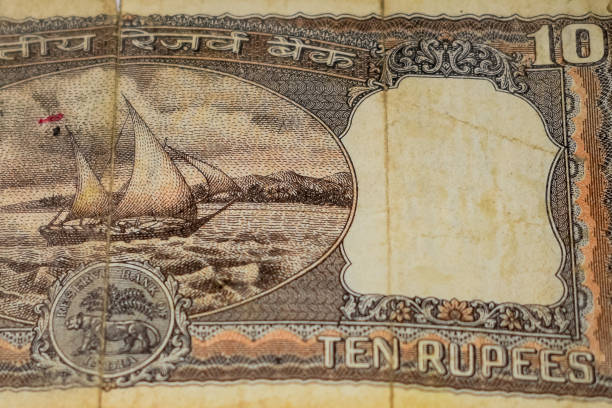 istock Close up view of rare ten rupee note on the table, Old Indian Currency notes on a rotating table, Rare Indian Currency close up view 1386402798