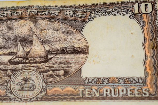 istock Close up view of rare ten rupee note on the table, Old Indian Currency notes on a rotating table, Rare Indian Currency close up view 1386402811