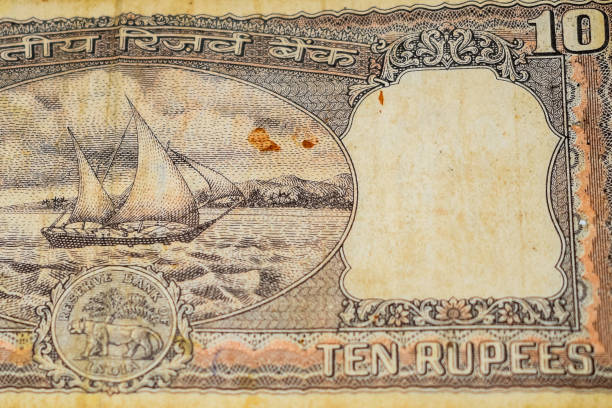 istock Close up view of rare ten rupee note on the table, Old Indian Currency notes on a rotating table, Rare Indian Currency close up view 1386402813